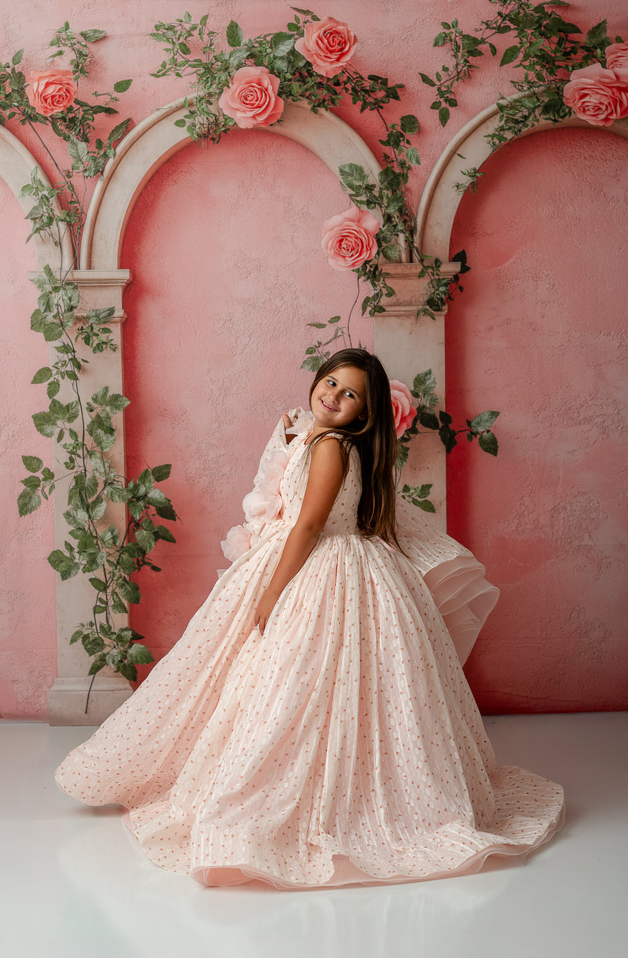 Detail of layered tulle skirt and floral embellishments on little girl’s Sugar Rosette gown

