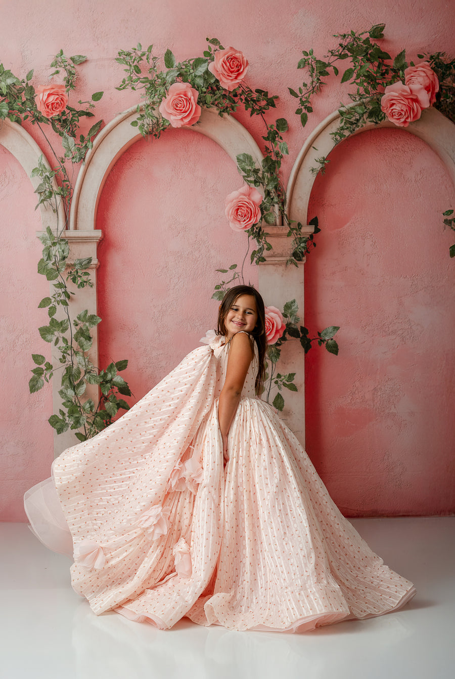 Soft chiffon detachable sleeves styled off-shoulder on young girl in Sugar Rosette dress


