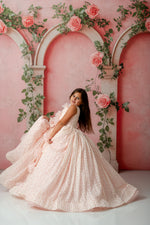 Side view of child in Sugar Rosette dress showing delicate dotted flower fabric

