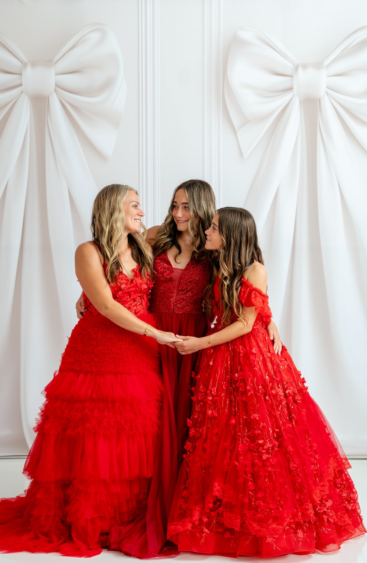 Detail shot of delicate spaghetti straps and structured bodice on the Sadie Red gown.

