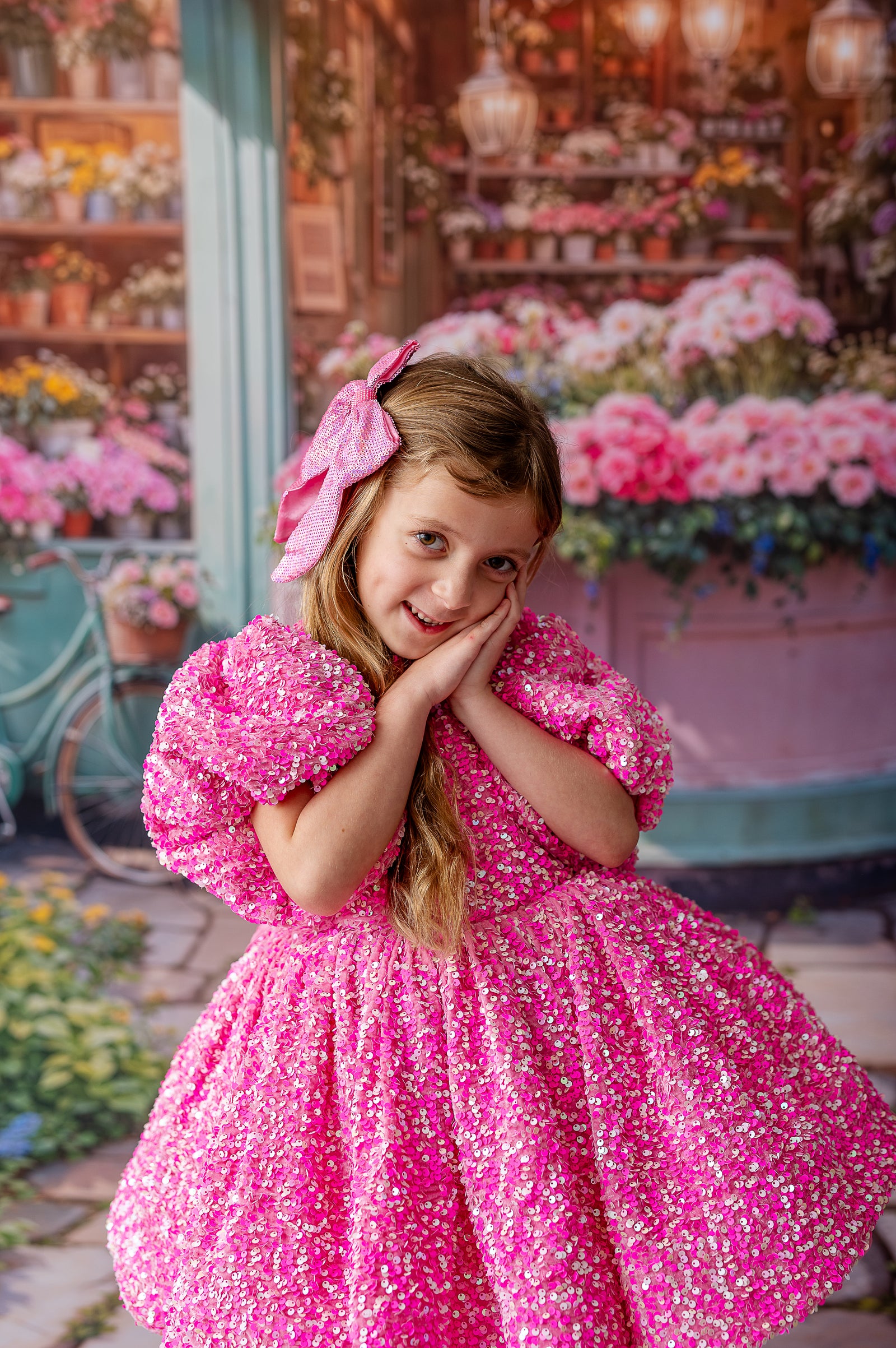 A statement couture dress with bold pink sequins and soft black tulle layers.
