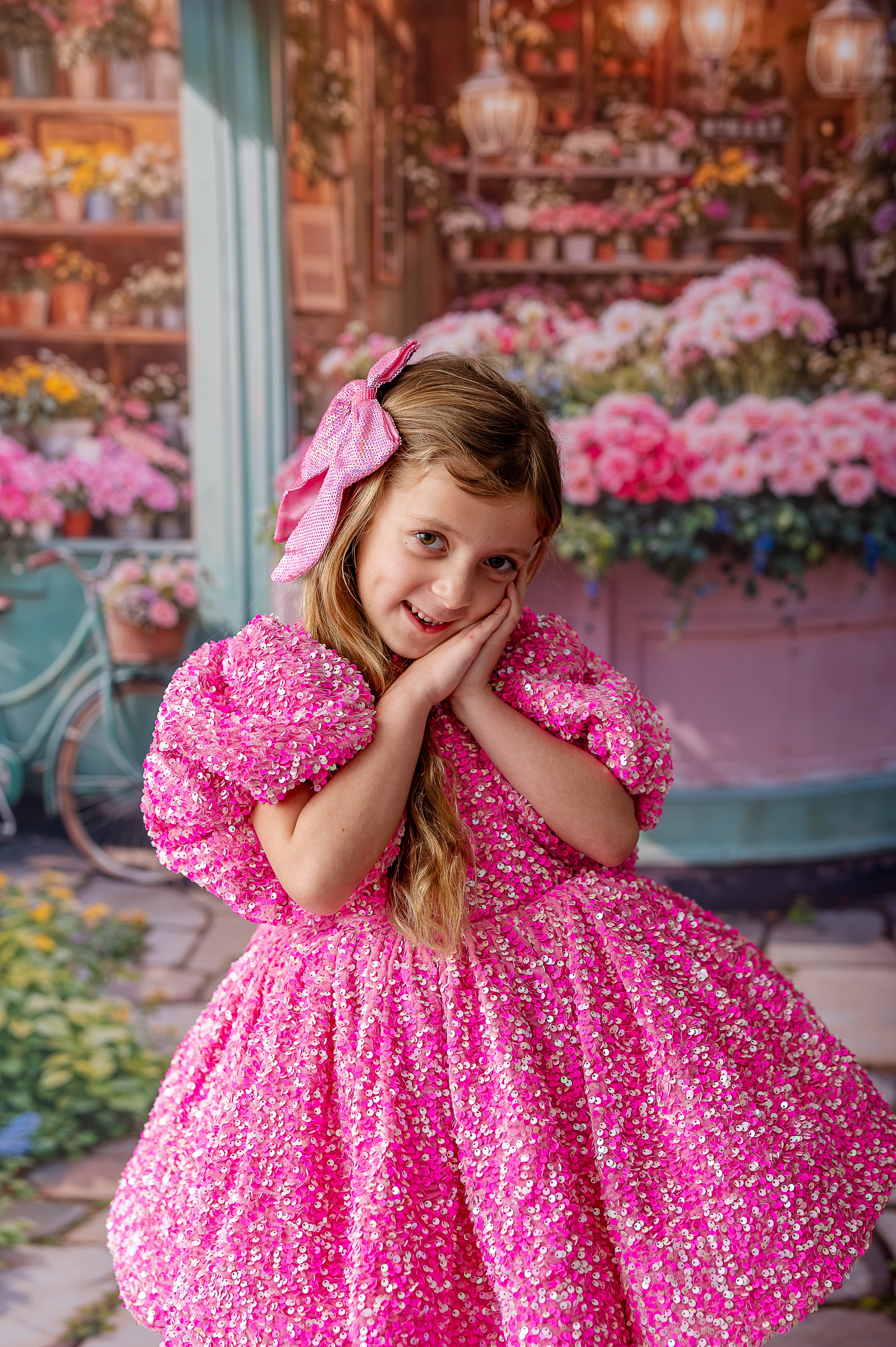 A statement couture dress with bold pink sequins and soft black tulle layers.
