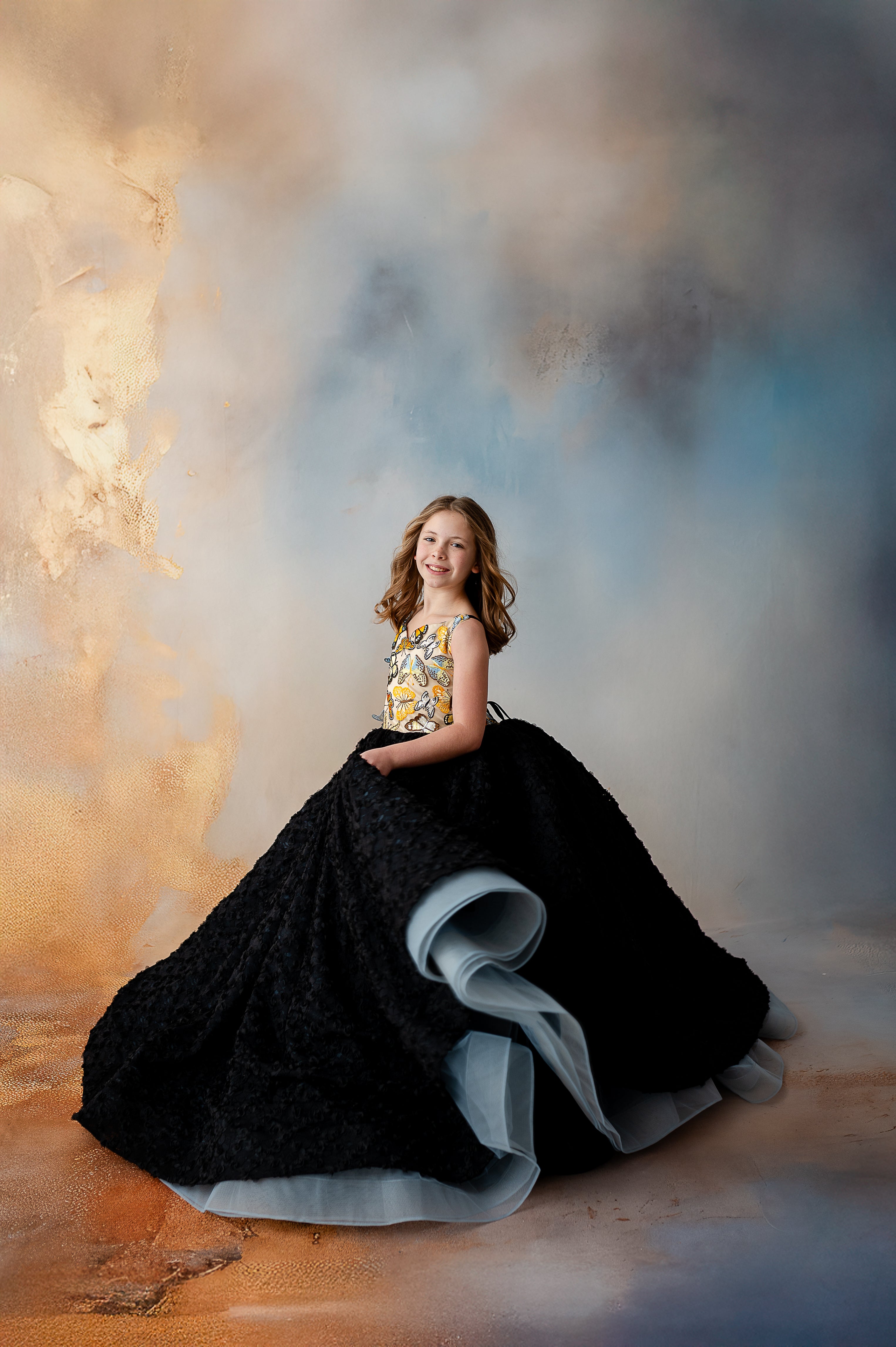 Floor-length gown featuring a dazzling butterfly motif on the bodice, paired with a stunning black skirt for a striking contrast.