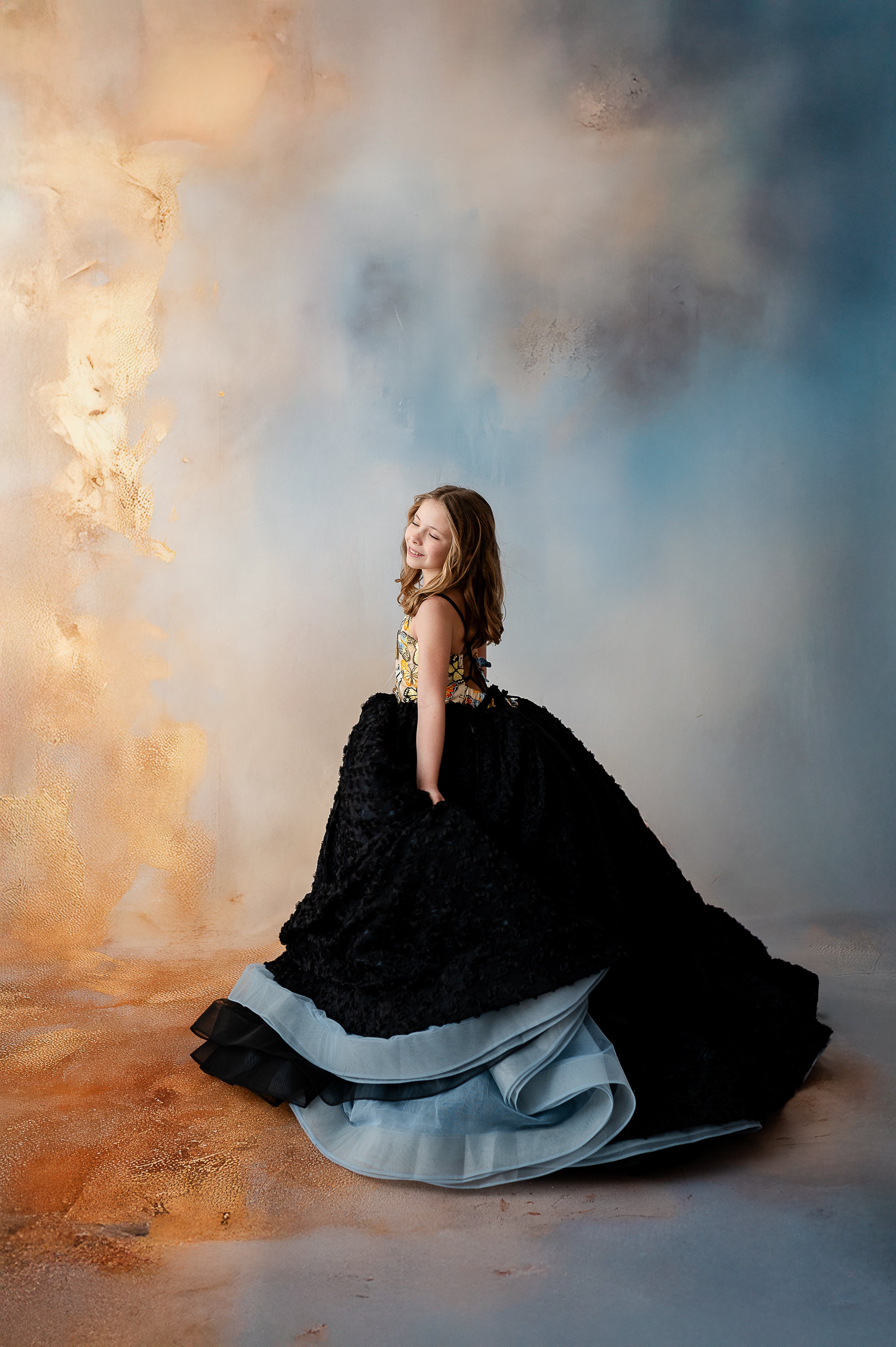 Elegant butterfly-inspired gown with a vibrant, colorful bodice and a flowing, dramatic black skirt, perfect for girls who love a bold statement.