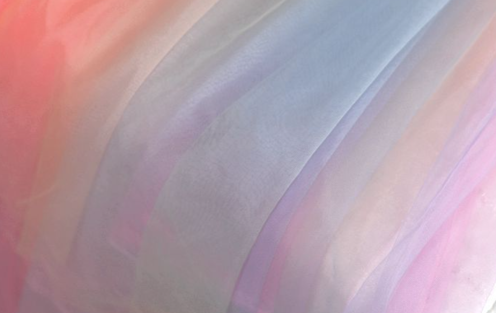 Chasing Rainbows dress in soft pastel hues with detachable tulle sleeves, designed for elegance.
