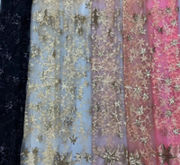 Back view showing adjustable shoulder ties and elastic back on the Golden Starlight gown

