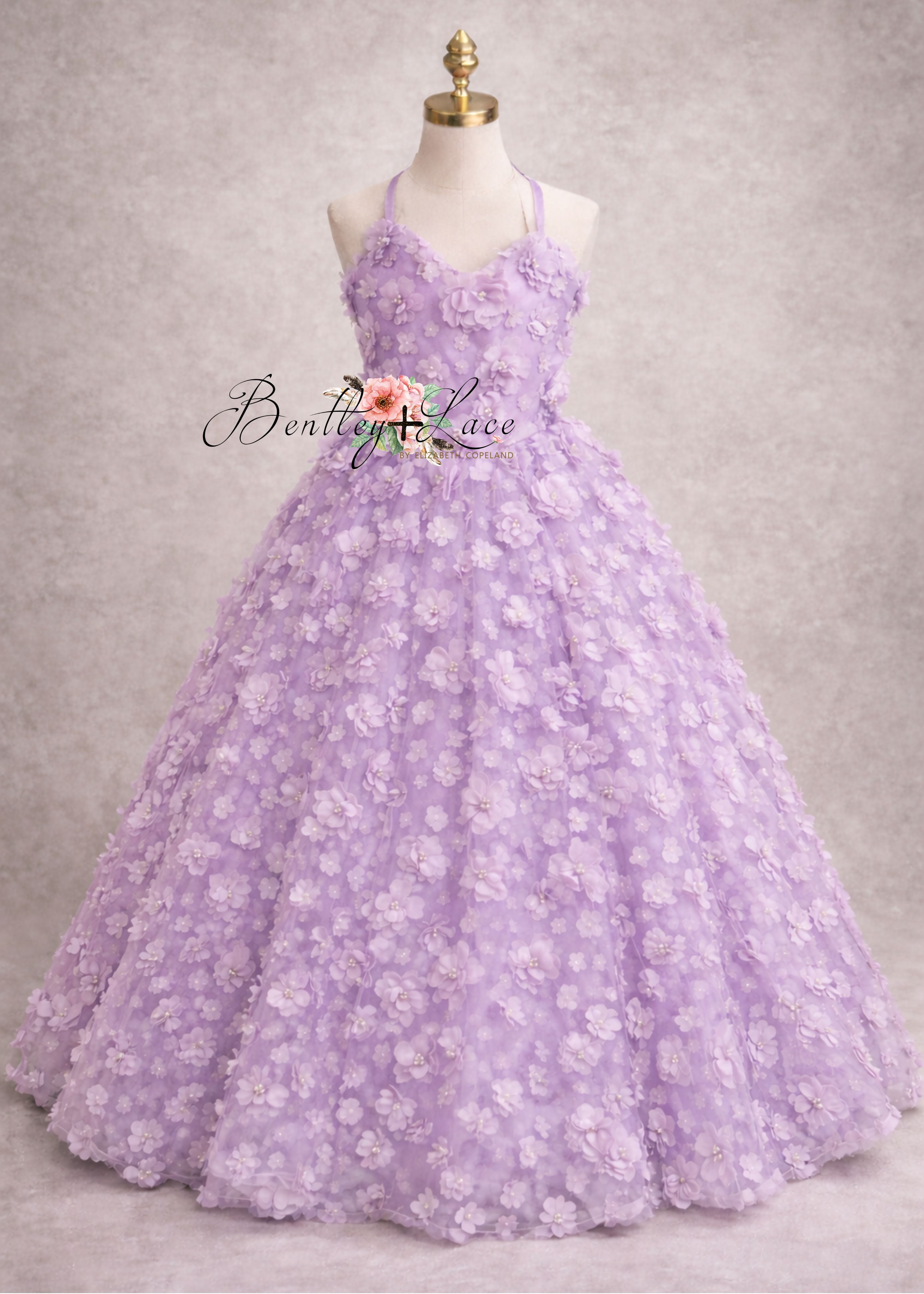 Lavender floral dress on a mannequin against a gray background with 'Bentley Lace' branding.