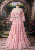 Pink floral dress on a mannequin against a garden backdrop