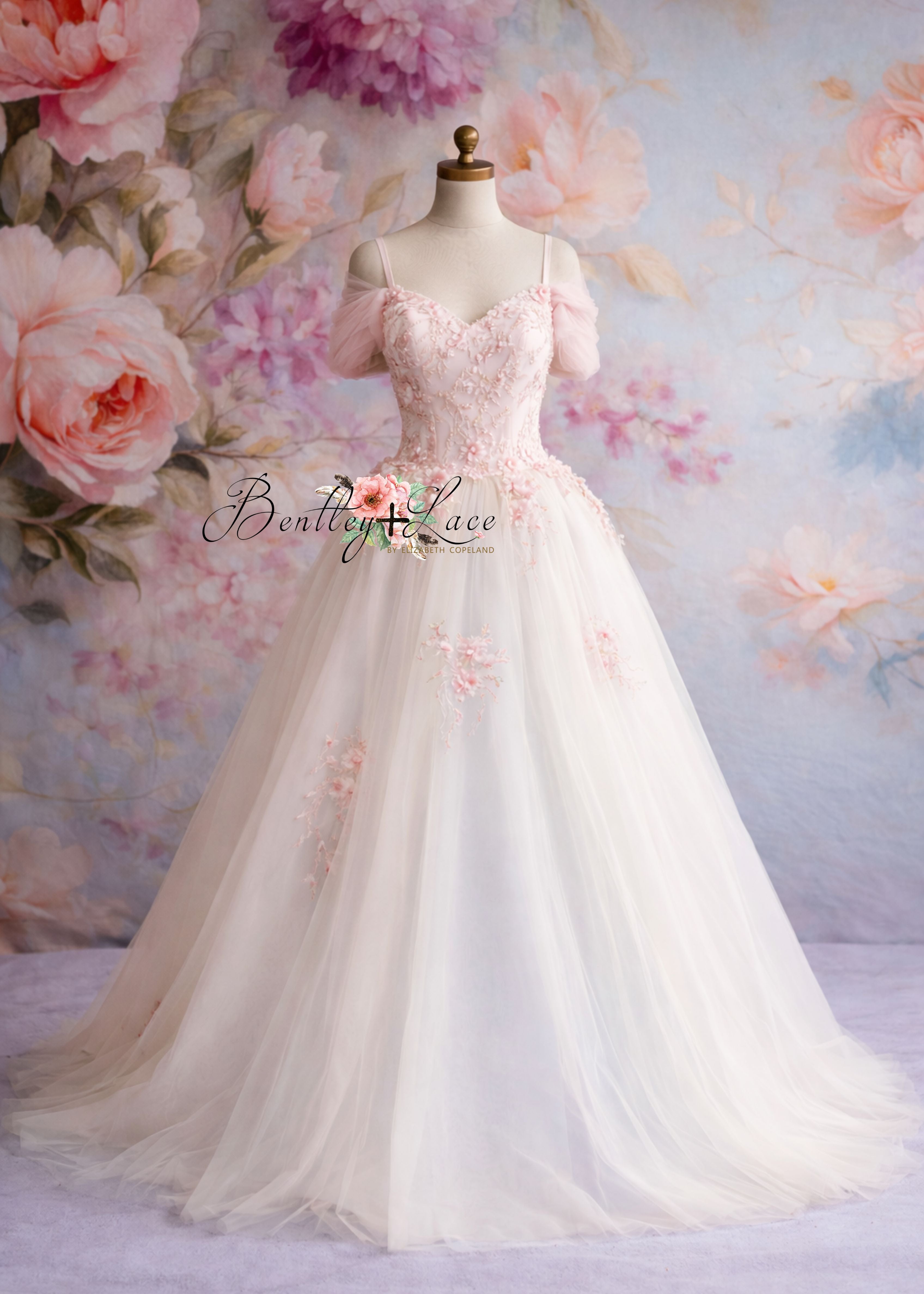 White wedding dress with floral details on a mannequin against a floral background