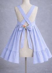 Blue and white checkered dress on a mannequin against a gray background