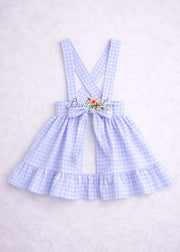 Light blue checkered dress with suspenders on a white background