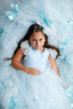 "Child model twirling in the Whimsy Bows Gown, ideal for birthday, pageant, or styled shoot"

