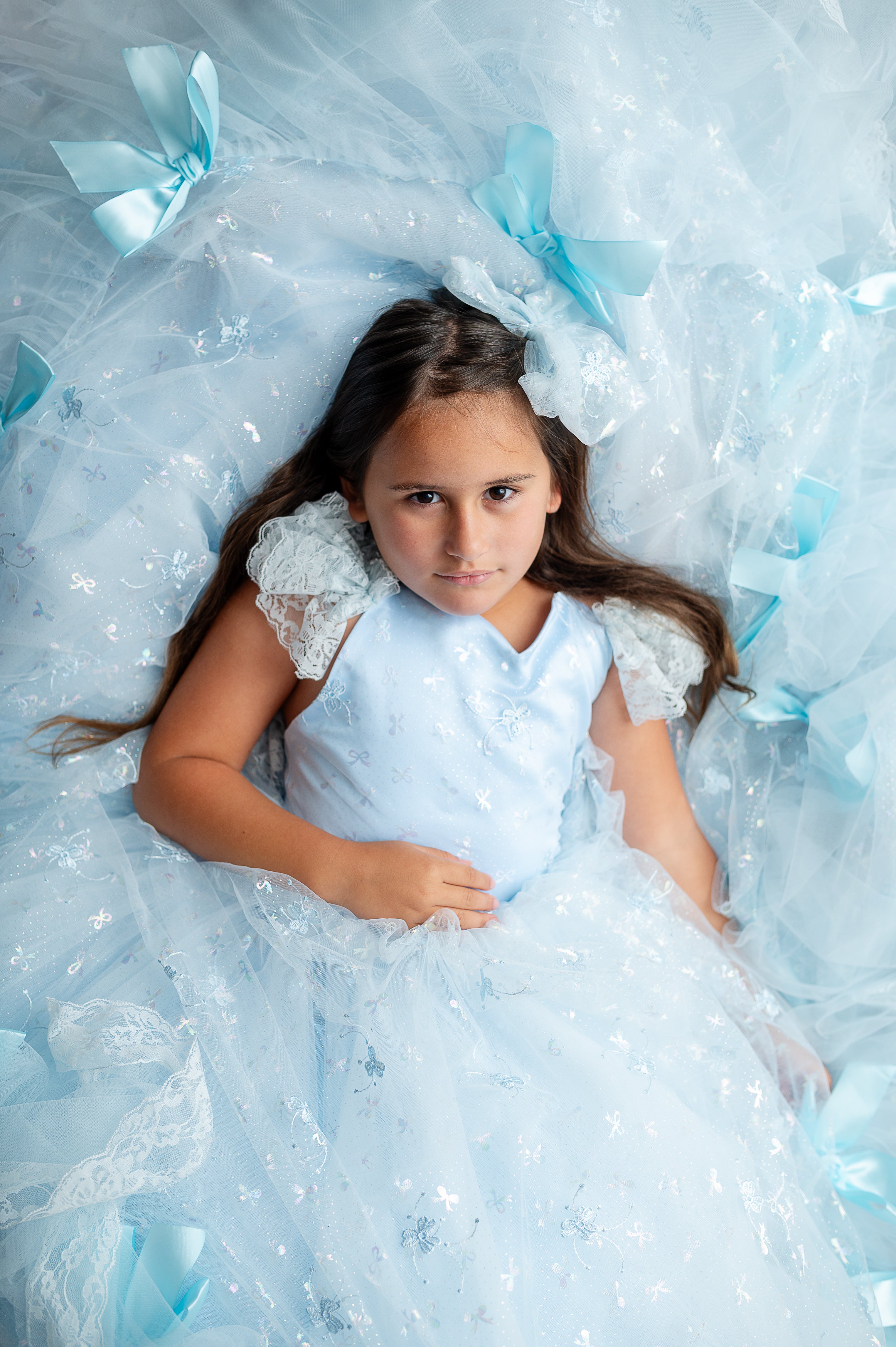 "Child model twirling in the Whimsy Bows Gown, ideal for birthday, pageant, or styled shoot"

