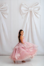 "Full-length girls pastel gown with soft ombré tulle layers and removable sleeve details"

