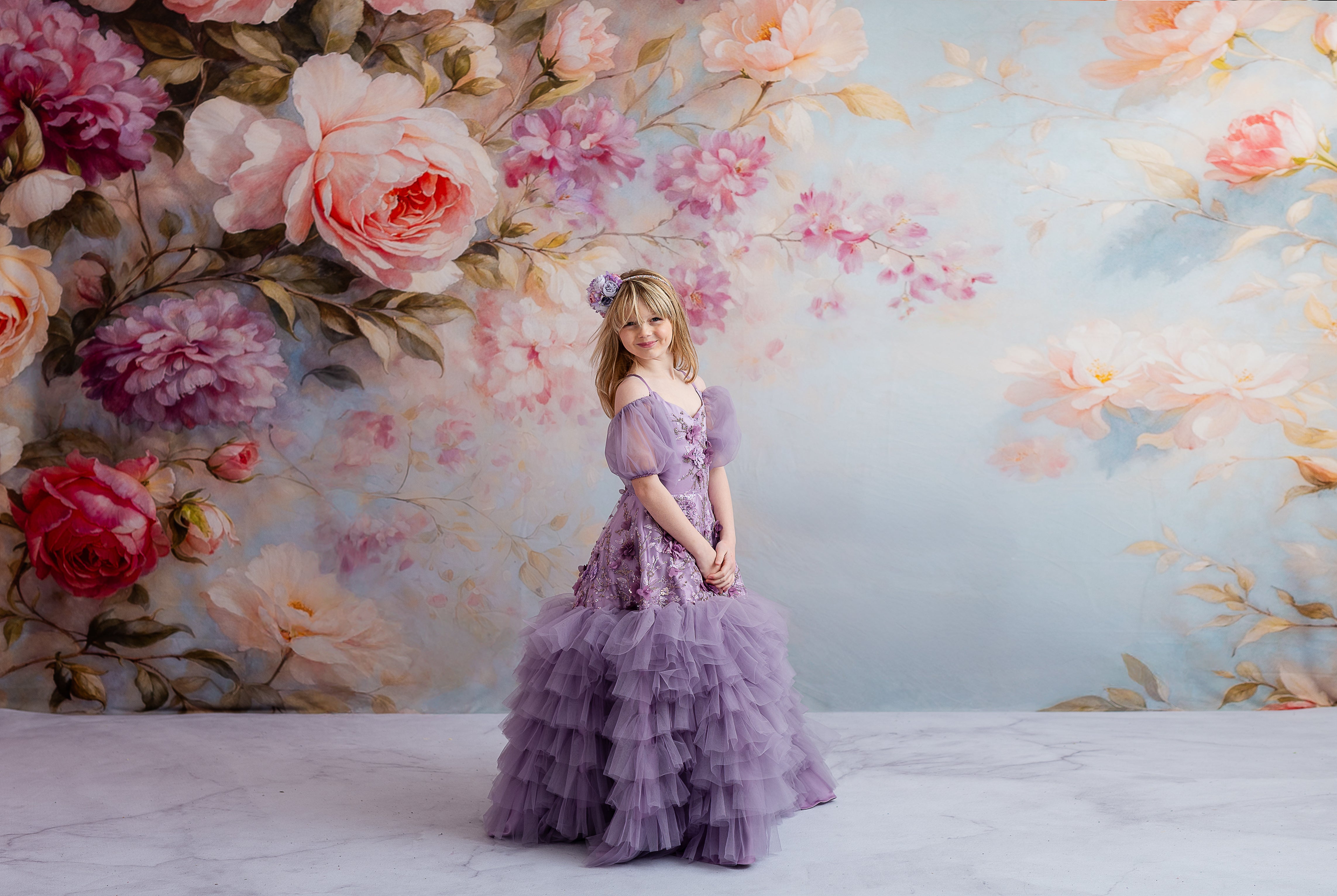 "Charming floor-length lavender dress with floral embellishments and detachable puff sleeves for a soft, enchanting style."
