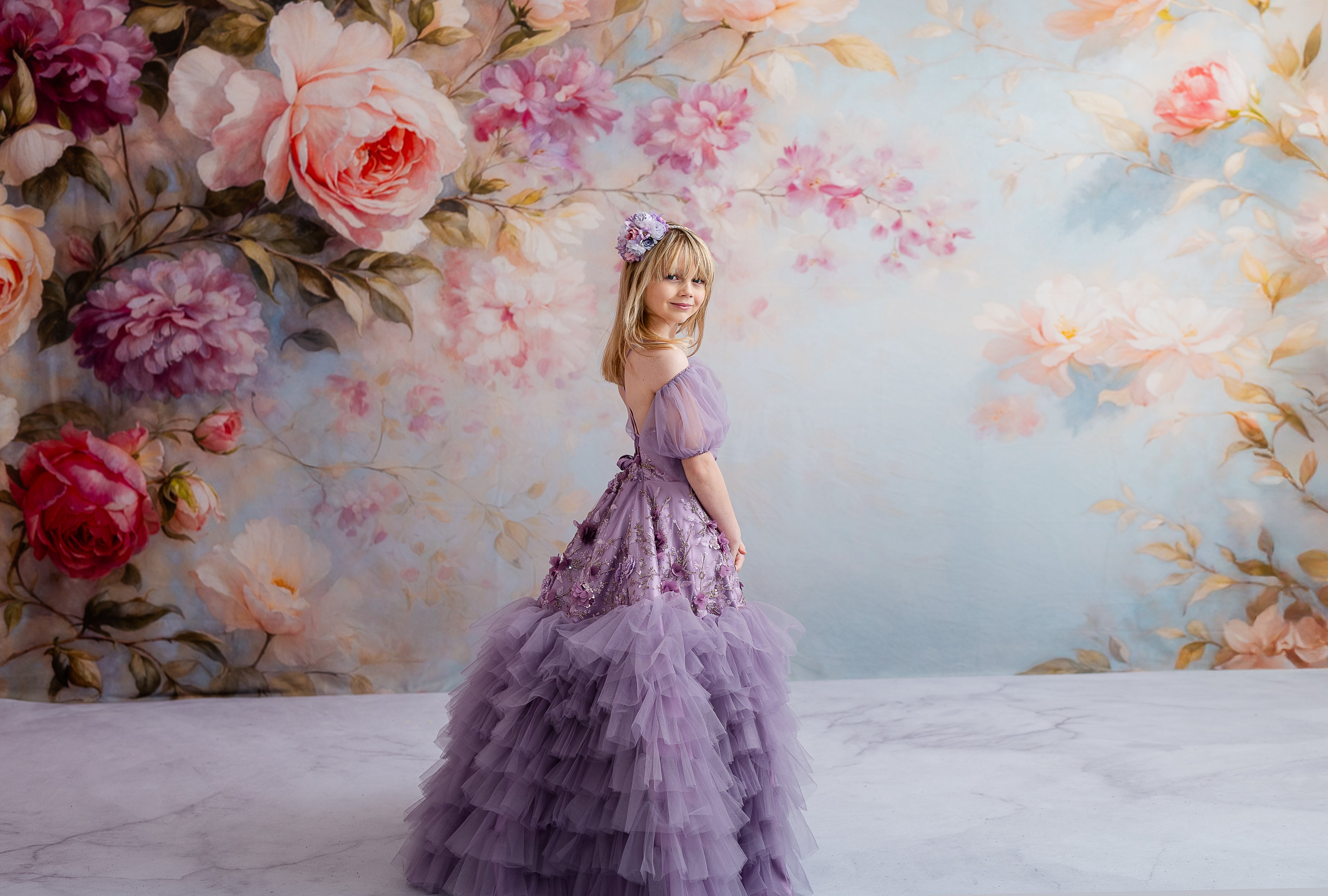 "Romantic lavender dress with floor-length elegance, detailed floral appliqués, and detachable puff sleeves for added charm."
