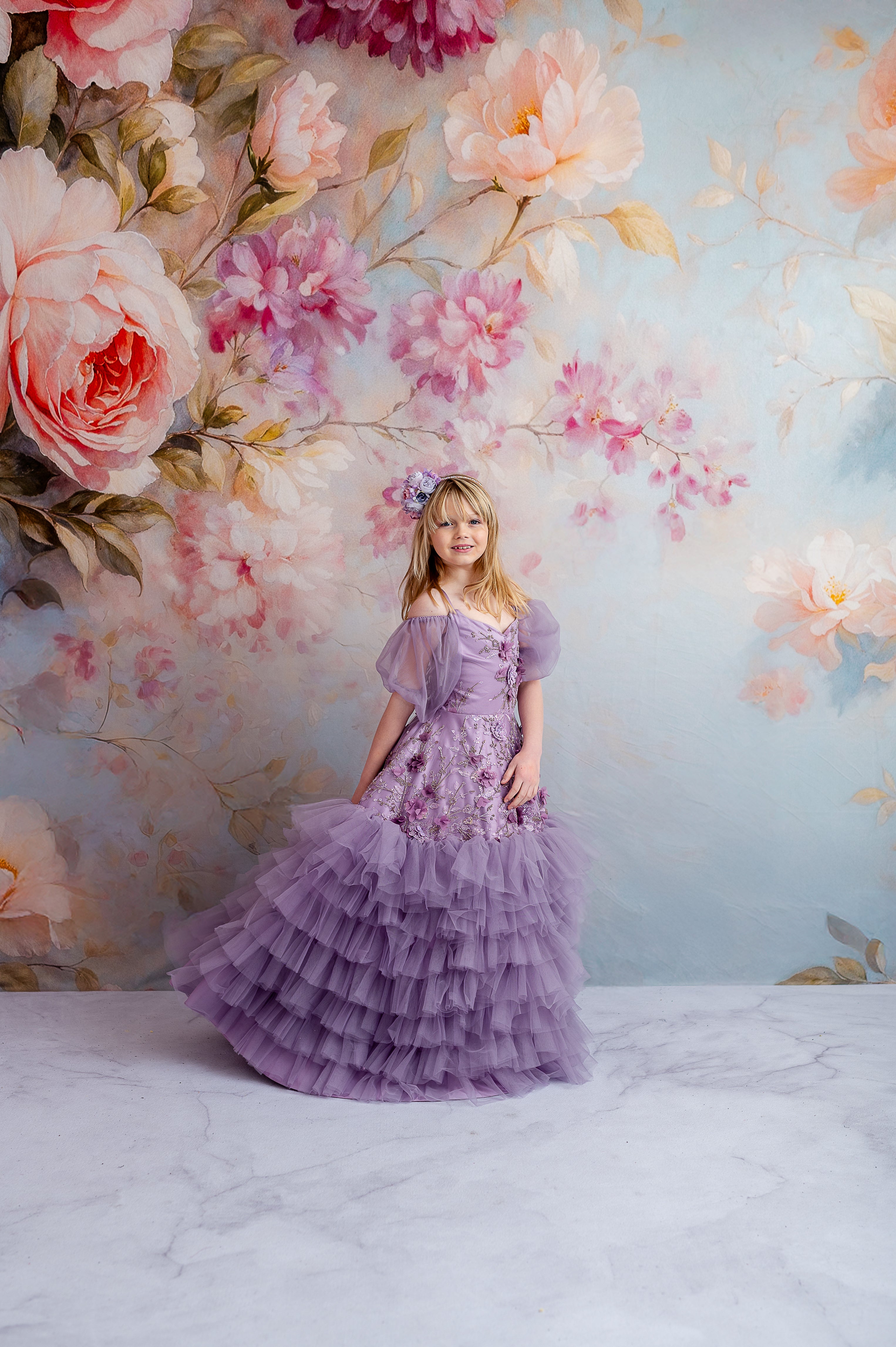 "Ethereal lavender gown featuring dainty floral appliqués and removable puff sleeves, perfect for graceful occasions."
