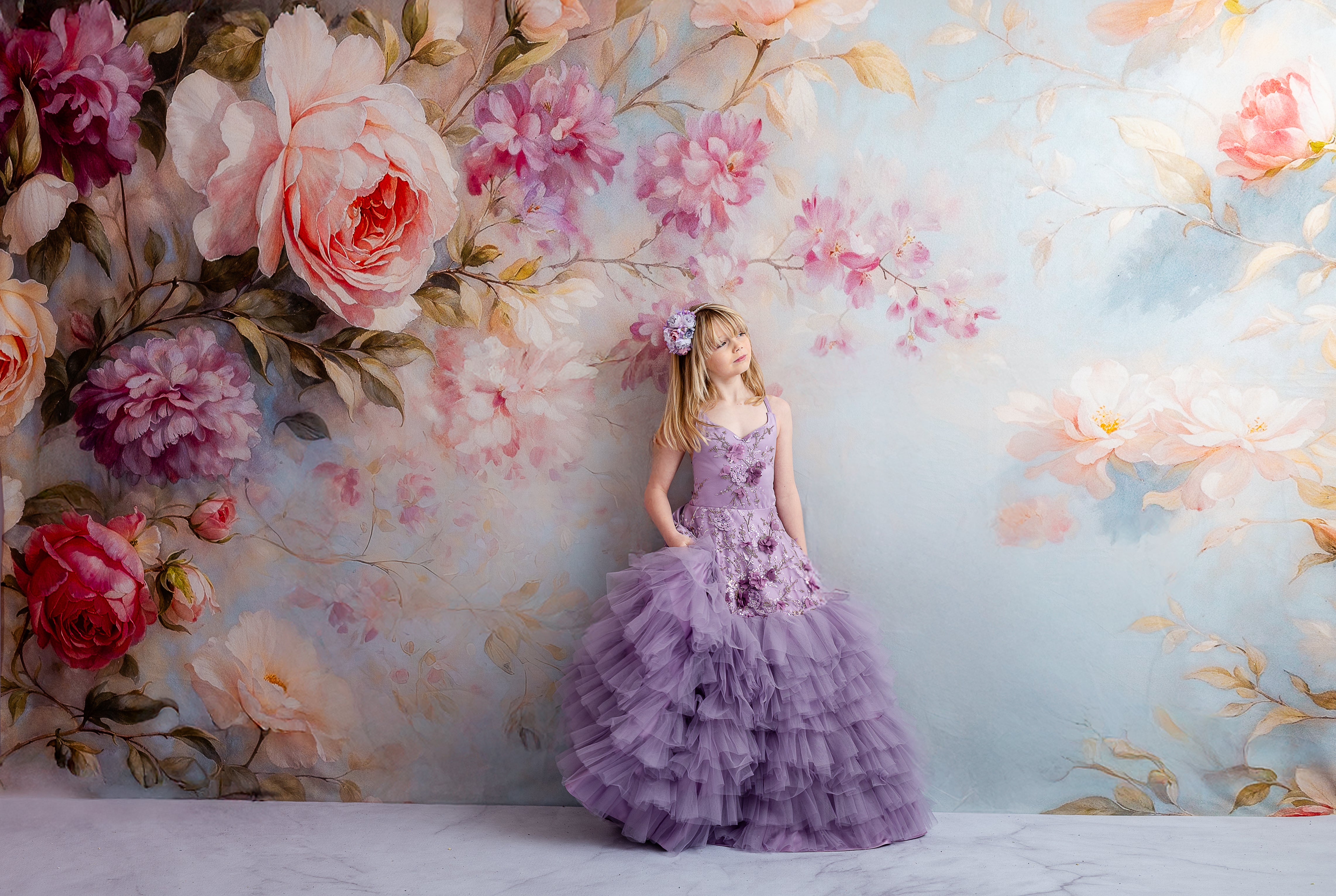 "Whimsical floor-length lavender dress with intricate floral details and removable puff sleeves for a fairy-tale vibe."
