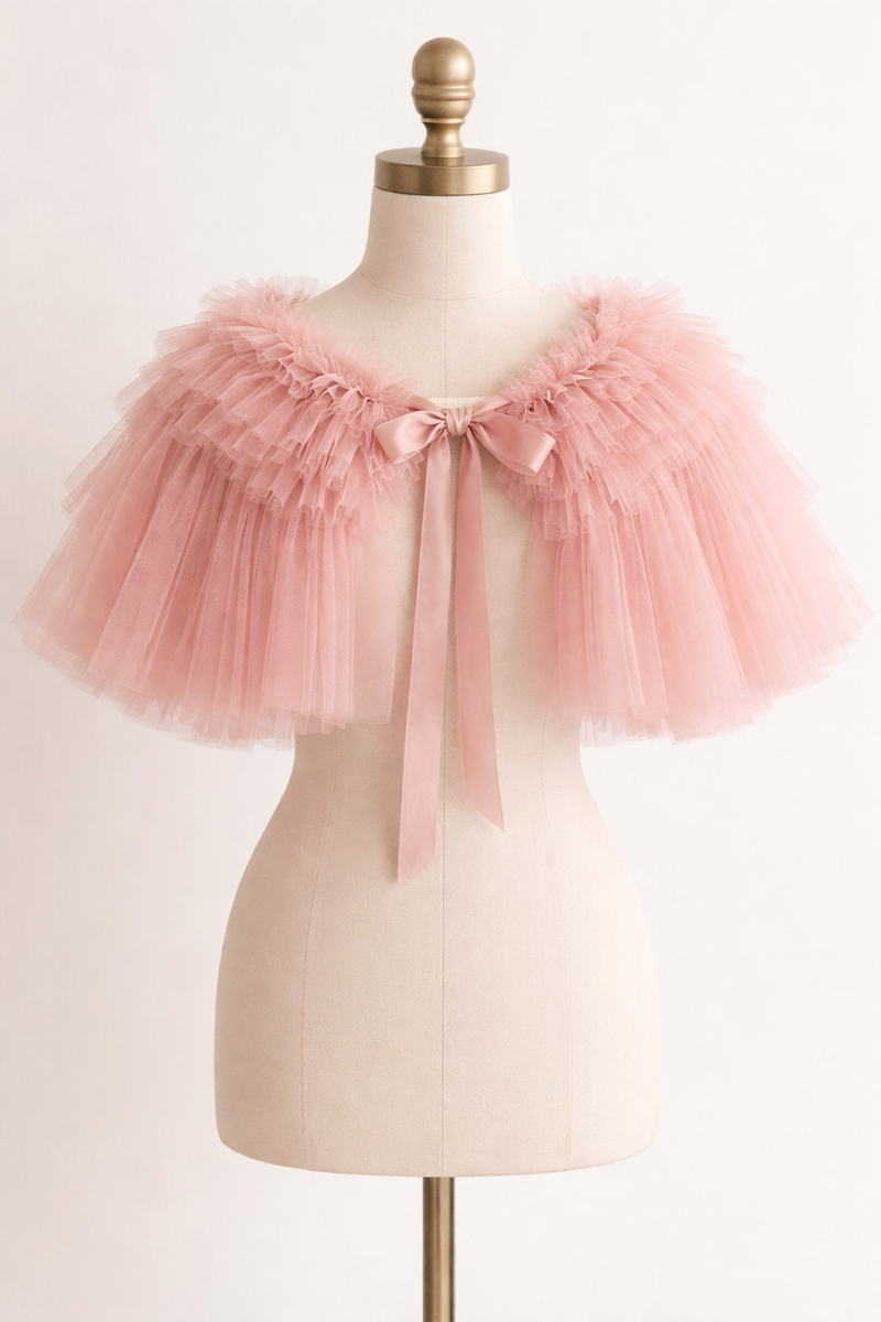 Pink tulle skirt on a mannequin against a light background