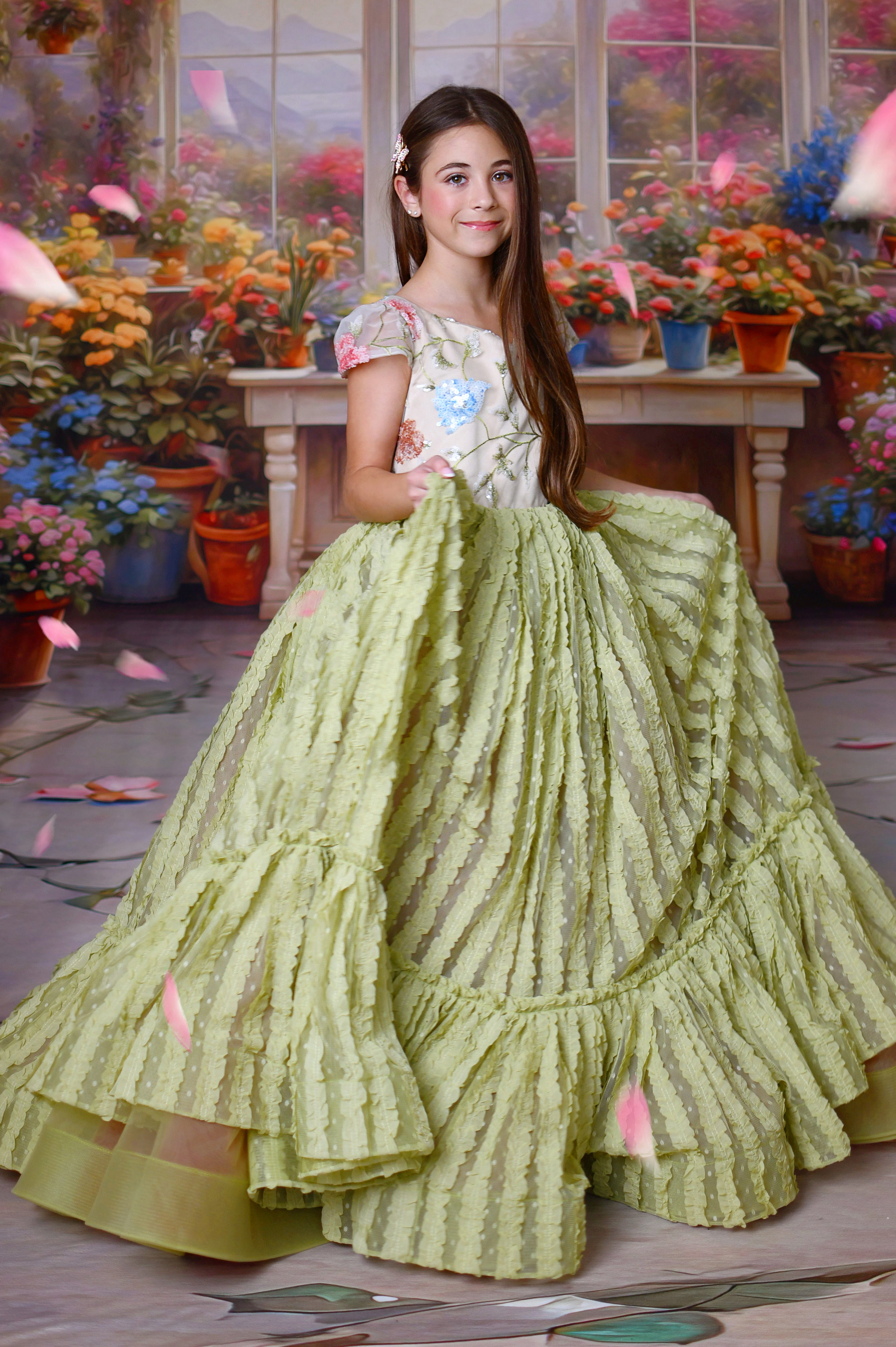 Close-up of floral embroidery and textured ruffles on the Willow Blossom Gown.
