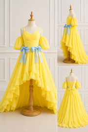 Yellow dress with blue ribbons on a mannequin against a white wall.