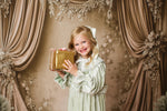 Close-up of Eleanor’s Dream vintage gown fabric texture and delicate detailing in sage green for styled children’s portraits.

