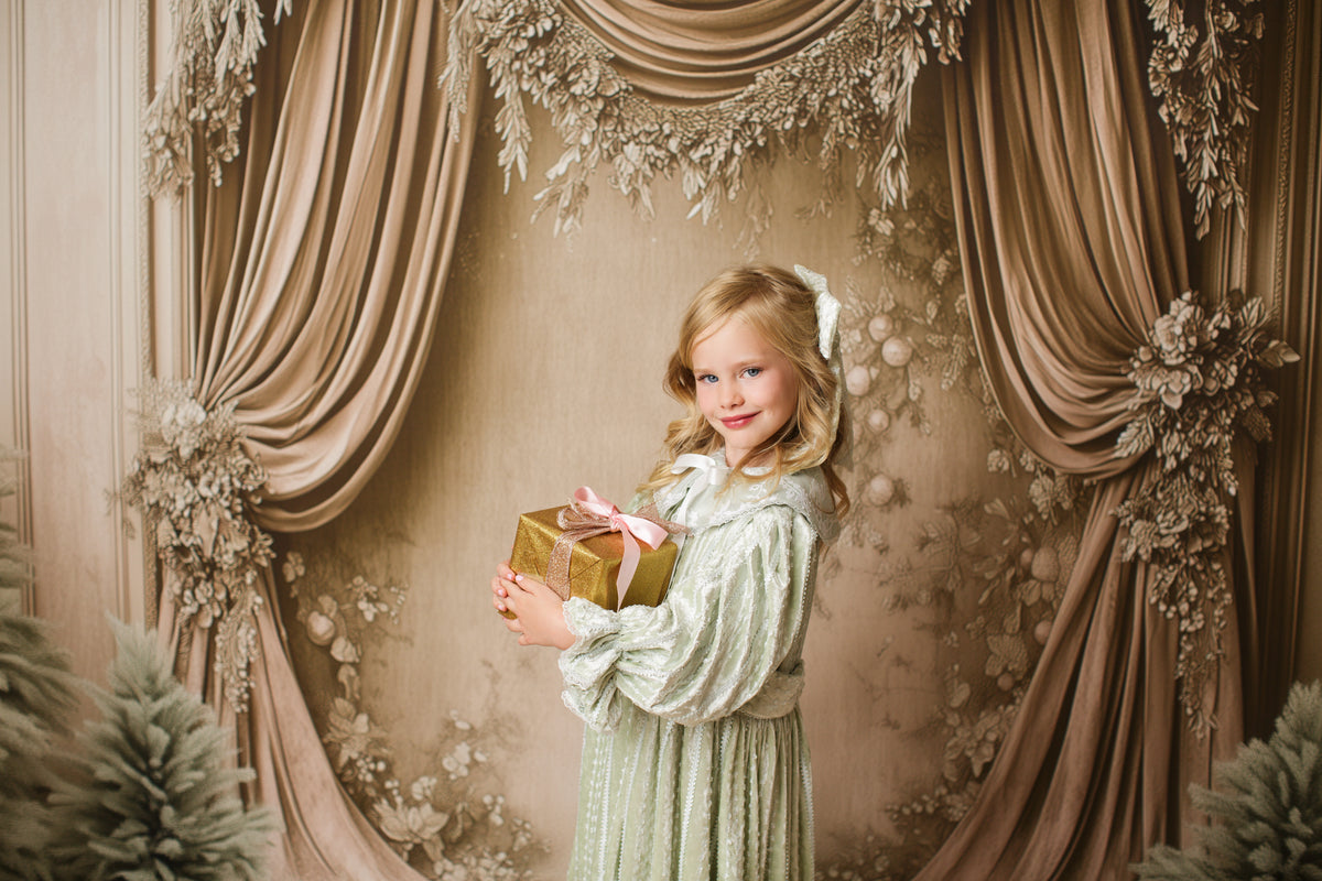 Vintage-inspired sage green children’s gown Eleanor’s Dream featuring coordinating bonnet and softly textured fabric.


