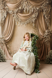Elegant sage green children’s dress Eleanor’s Dream with coordinating bonnet and hidden back zipper for easy dressing.

