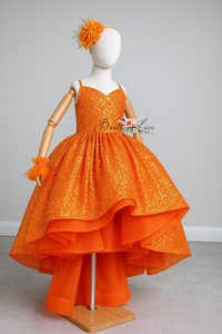 Orange dress on a mannequin with a gray background