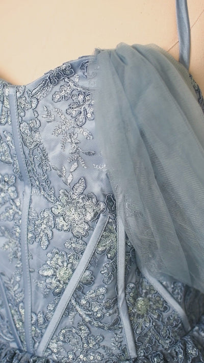 Close-up of embroidered bodice with shimmering sequin details

