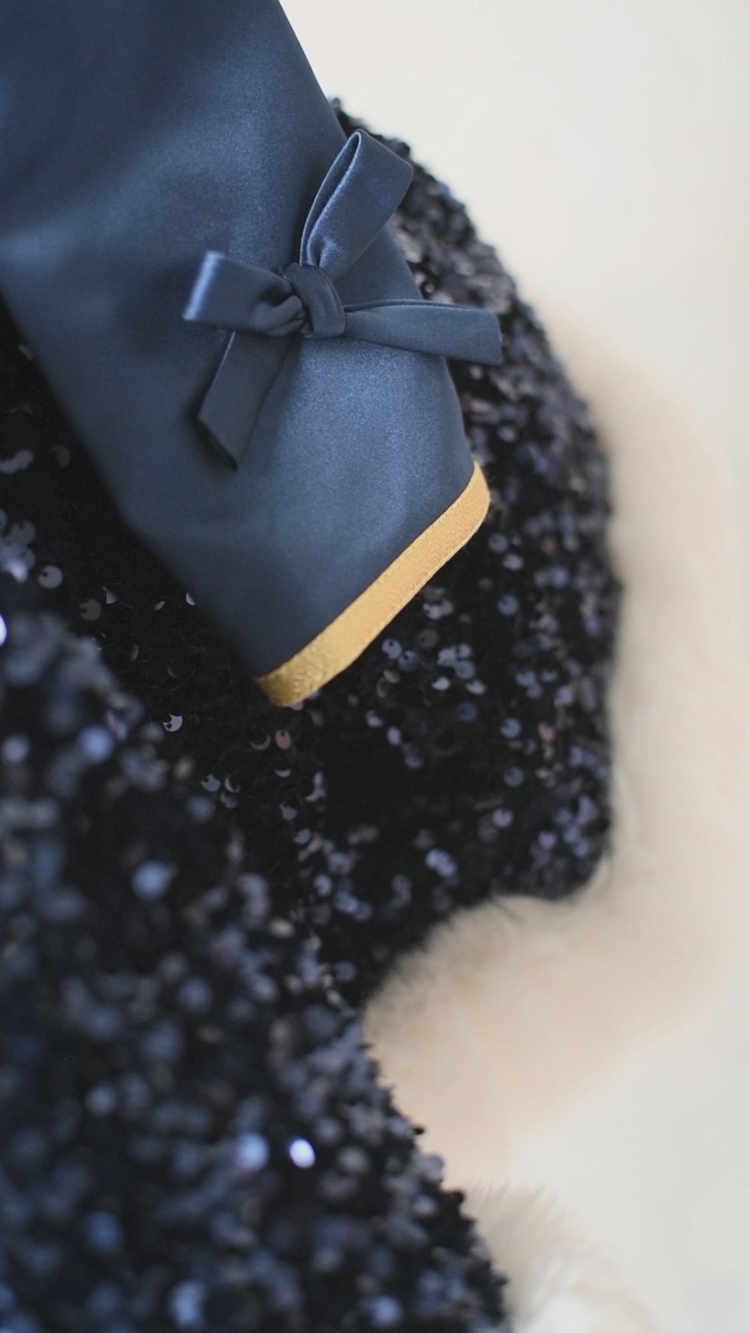 Editorial view of sequin sparkle with faux fur trim on Christmas couture gown

