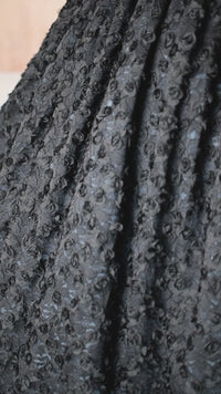 Stunning couture gown for girls featuring butterflies and a voluminous floral-textured skirt.
