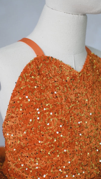 Couture orange sequin gown for Swiftie-themed birthday photoshoot or concert event.