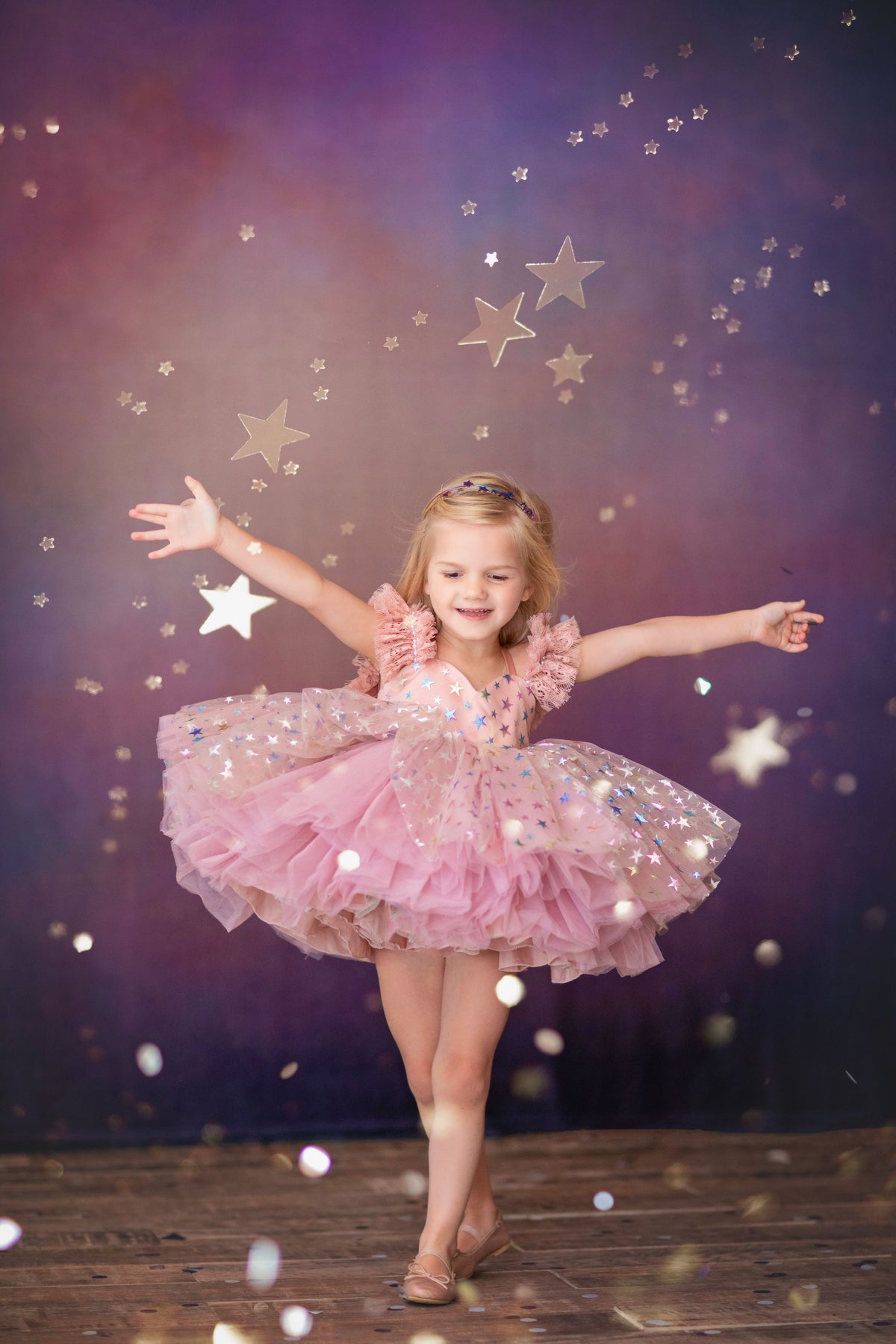 Little girl twirling in vintage-length Star Confetti gown

