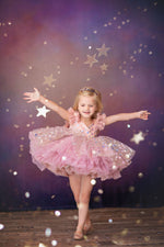 Little girl twirling in vintage-length Star Confetti gown

