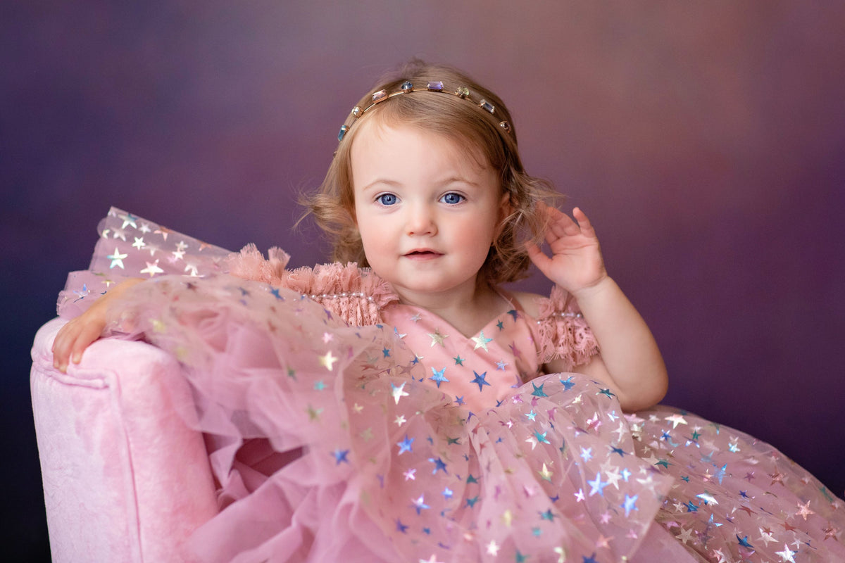 Star-themed dress perfect for styled photography sessions

