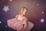 Whimsical flower girl dress with star confetti fabric and full skirt

