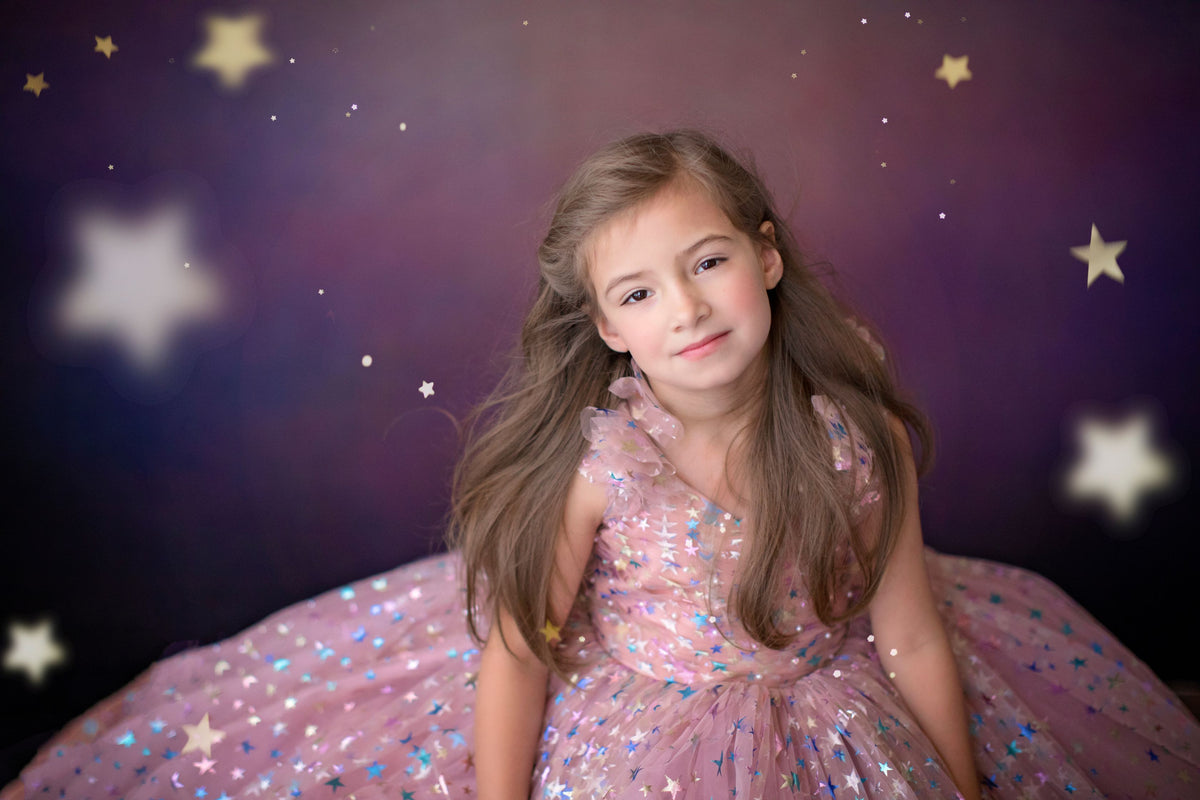 Editorial shot of Star Confetti gown glowing in golden hour light

