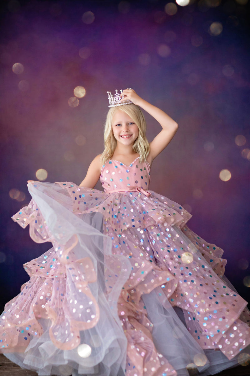 Girl in floor-length Confetti gown posing for flower girl photo shoot

