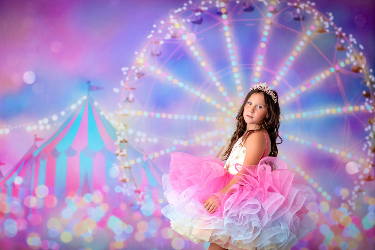 Girl holding a sparkly wand while wearing the Golden Starlight gown

