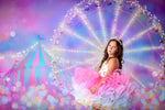Girl holding a sparkly wand while wearing the Golden Starlight gown

