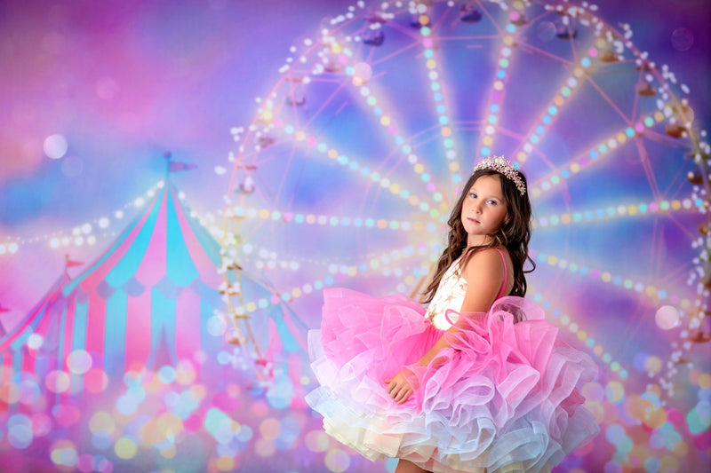 Girl holding a sparkly wand while wearing the Golden Starlight gown

