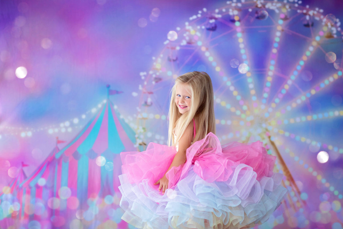 Birthday session featuring a child in the Golden Starlight gown outdoors

