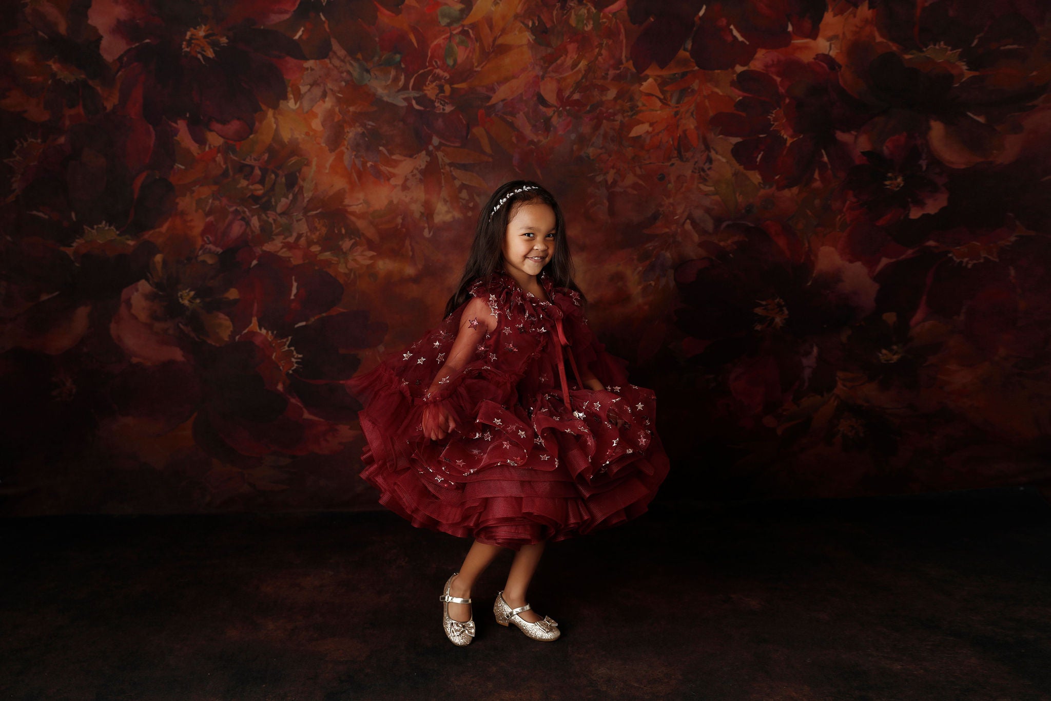 Starlet Burgundy Dress shown with cape draped gracefully over shoulders.

