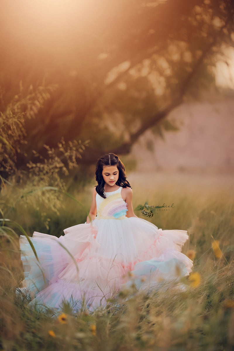 A rainbow dress with long sleeves and a tie waist, combining comfort with a bold rainbow aesthetic.


