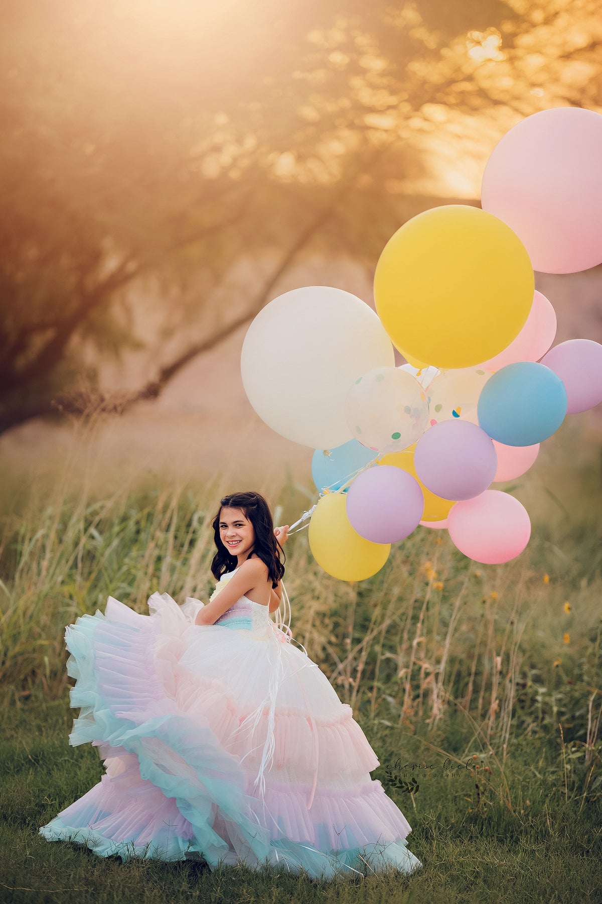 A sleeveless dress with a sweetheart neckline, showcasing a pastel rainbow ombre design for a subtle yet playful appearance.

