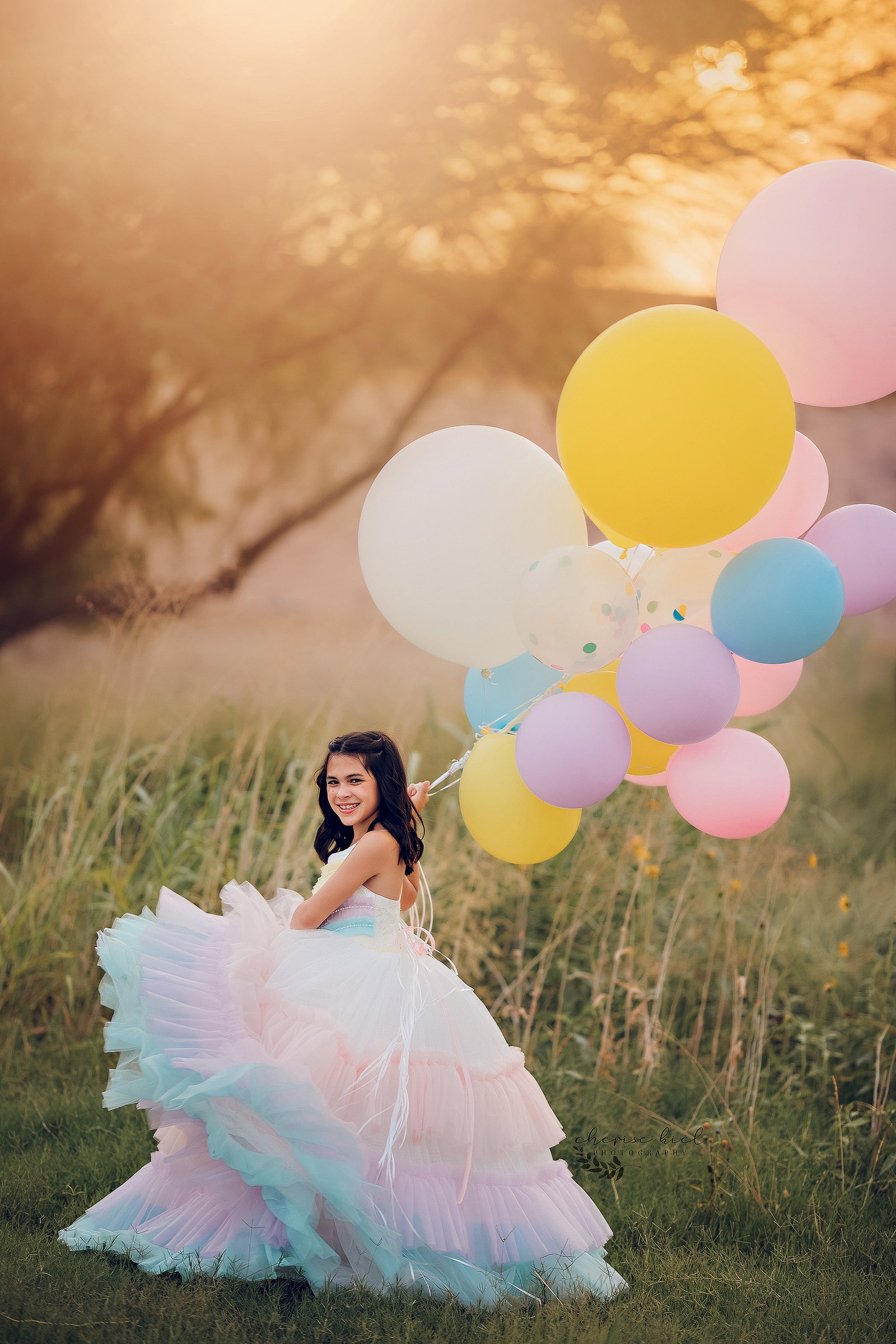 A sleeveless dress with a sweetheart neckline, showcasing a pastel rainbow ombre design for a subtle yet playful appearance.

