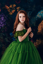 “Full-length custom couture gowns with sweeping skirts and refined details.”