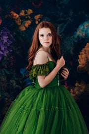 “Full-length custom couture gowns with sweeping skirts and refined details.”