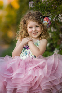 “Children’s petal length dresses in soft, flowing fabrics with delicate details, styled for photography sessions and special occasions.”

